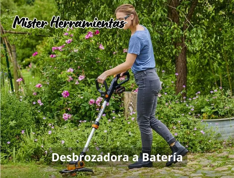 mujer usando desbrozadora a batería en jardín recortando césped
